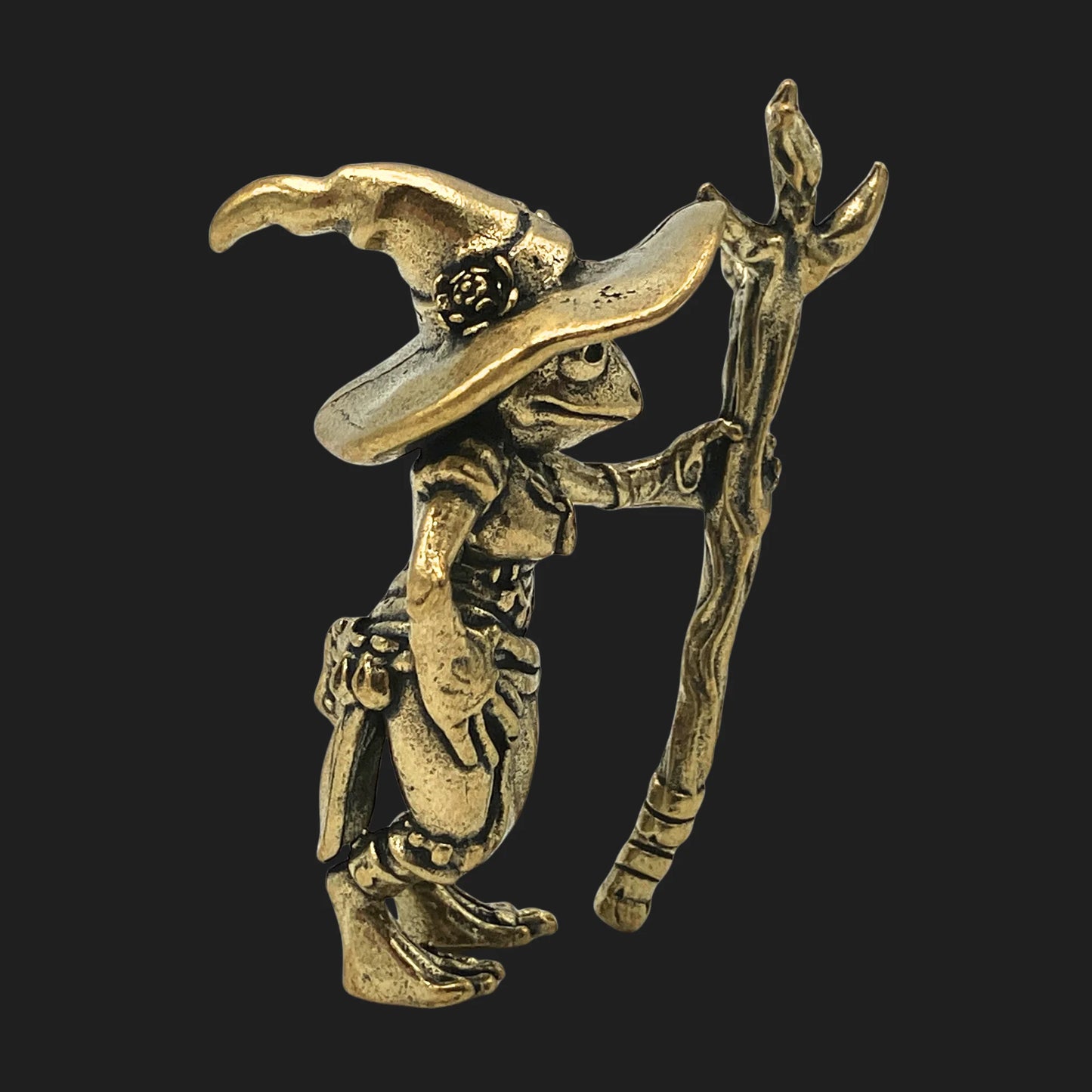 Side view of bronze Loveland Frogman wizard figurine holding staff