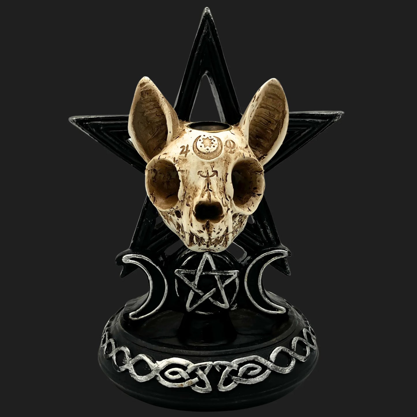 Occult cat skull statue with engraved runes, black pentagram backdrop, and crescent moon symbols