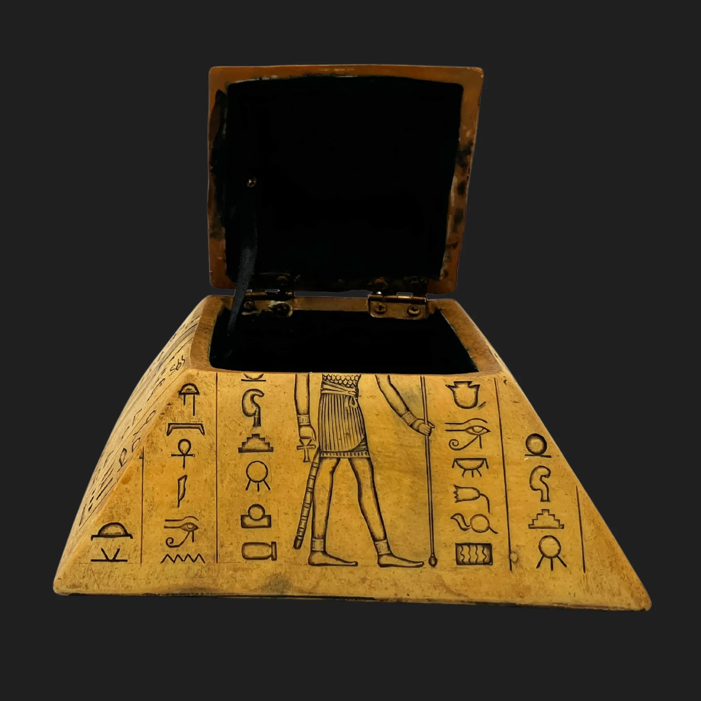 Open pyramid trinket box revealing black velvet treasure chamber