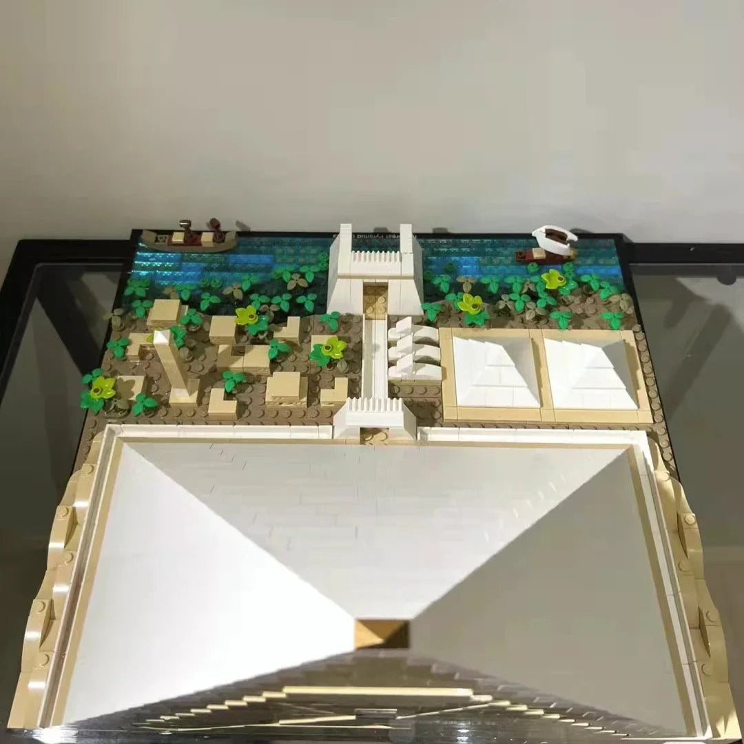 Top-down view of pyramid build kit showing detailed landscaping and water features