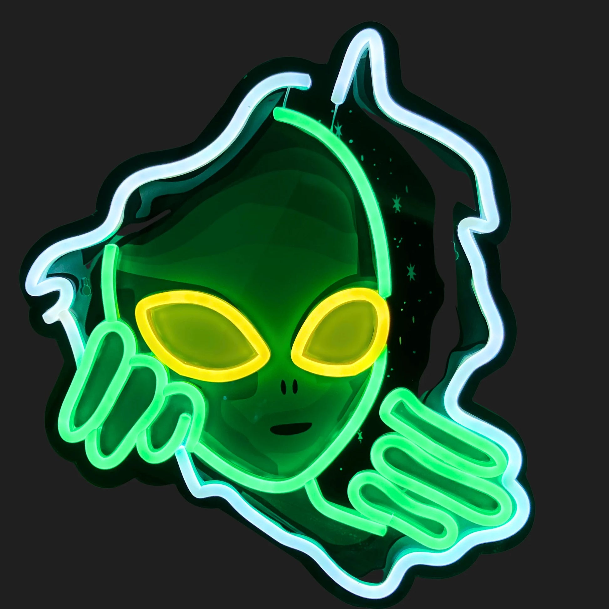 Green alien neon sign glowing on black wall – UFO inspired LED decor