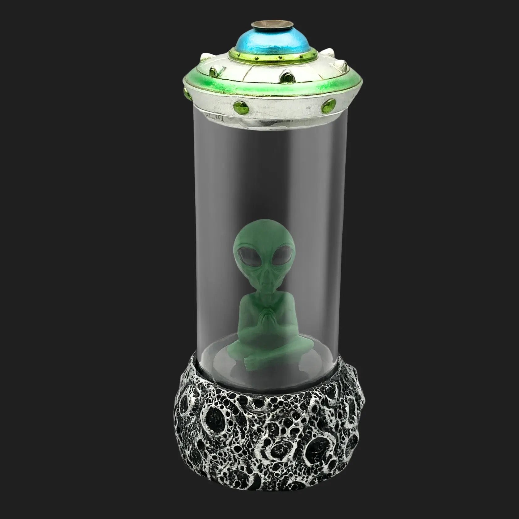 Front view of alien UFO incense burner with green alien inside smoky glass chamber