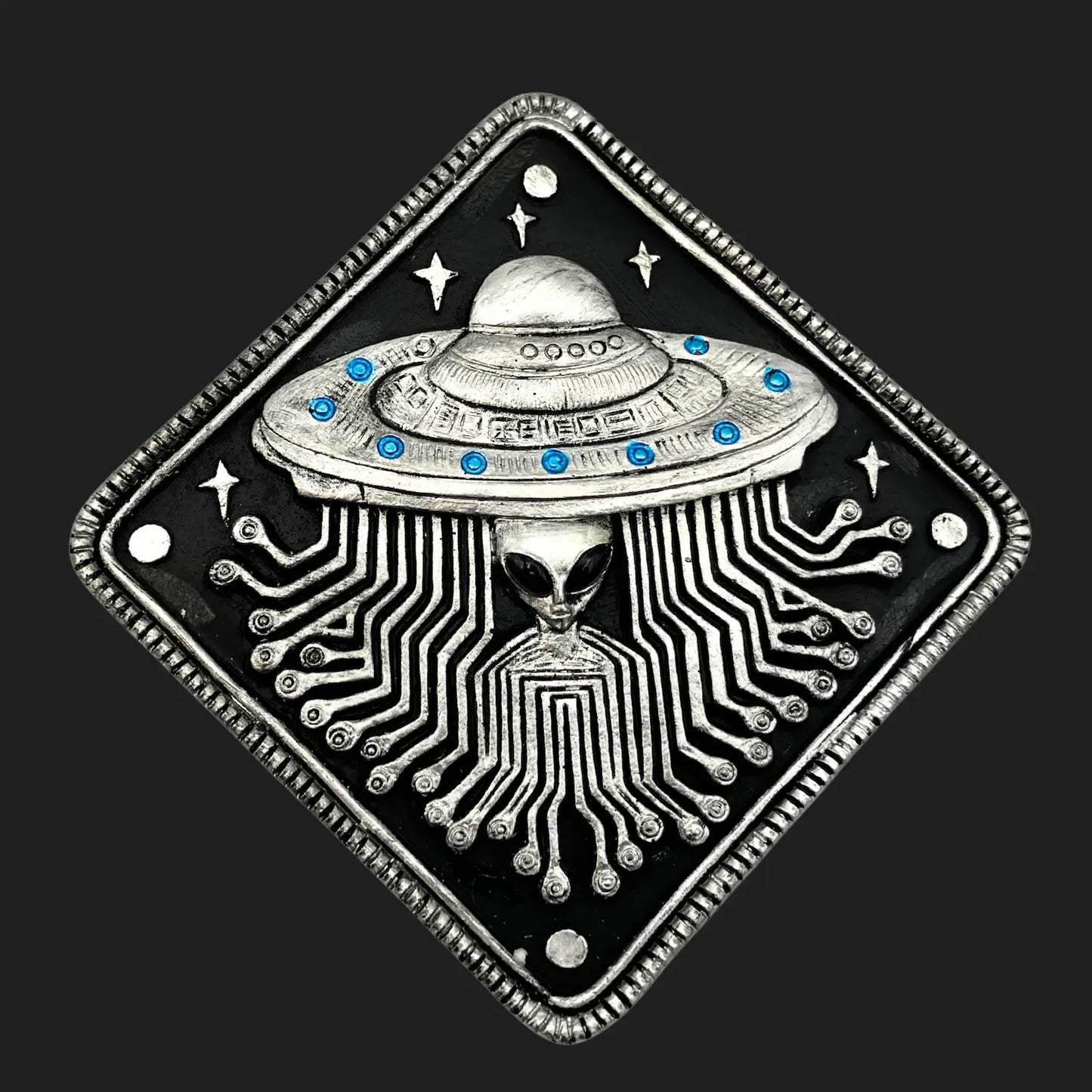 Top view of alien UFO trinket box lid featuring circuit board pattern and extraterrestrial face