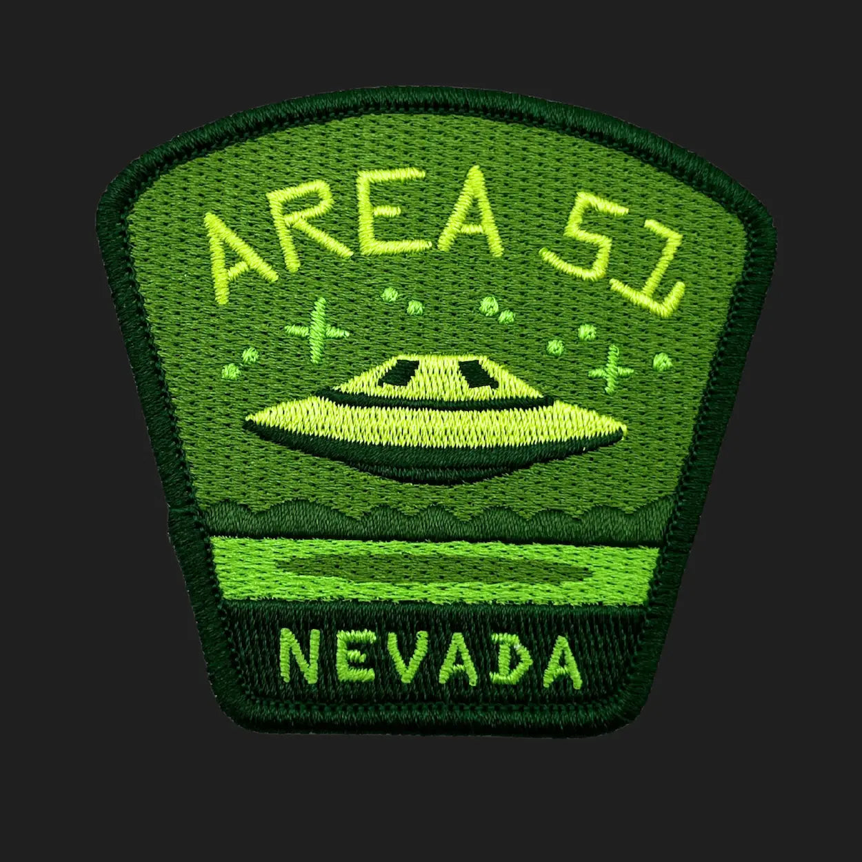 Area 51 UFO patch embroidered in green with flying saucer over Nevada desert