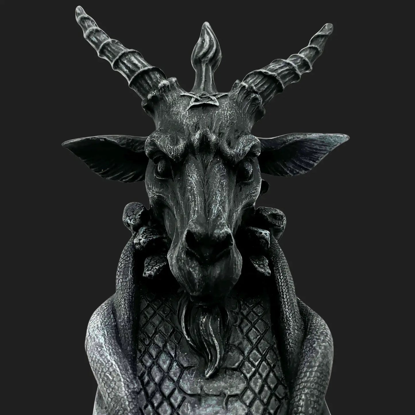 Close-up of goat-headed Baphomet incense burner with detailed horns and scales