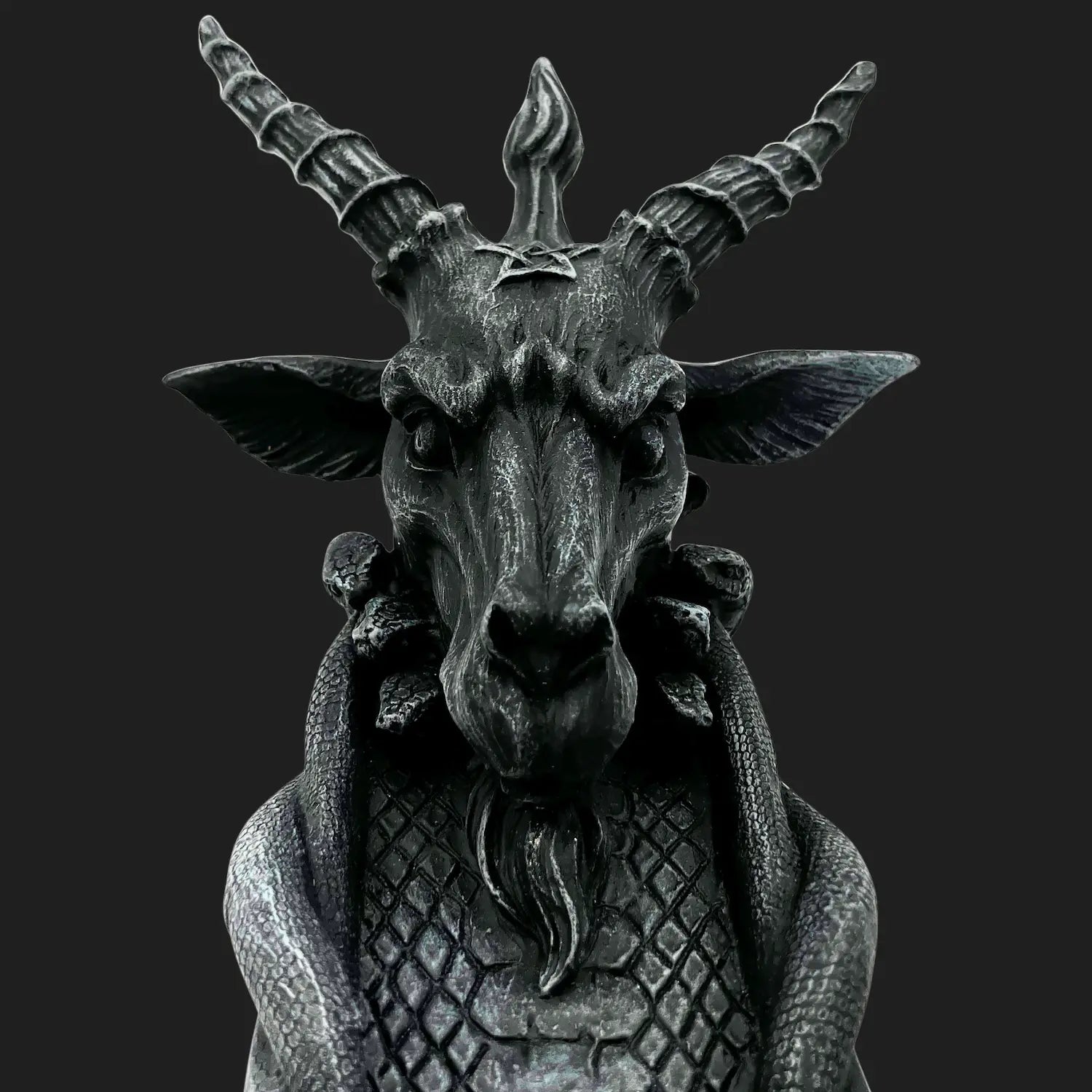 Close-up of goat-headed Baphomet incense burner with detailed horns and scales