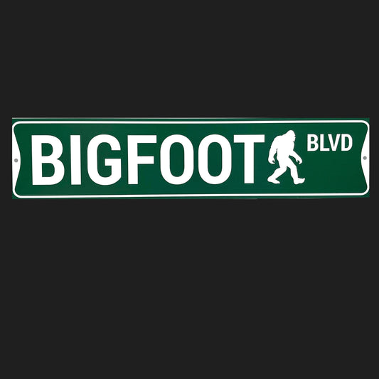 Street sign with 'BIGFOOT BLVD' text and a silhouette of a bigfoot on a black background