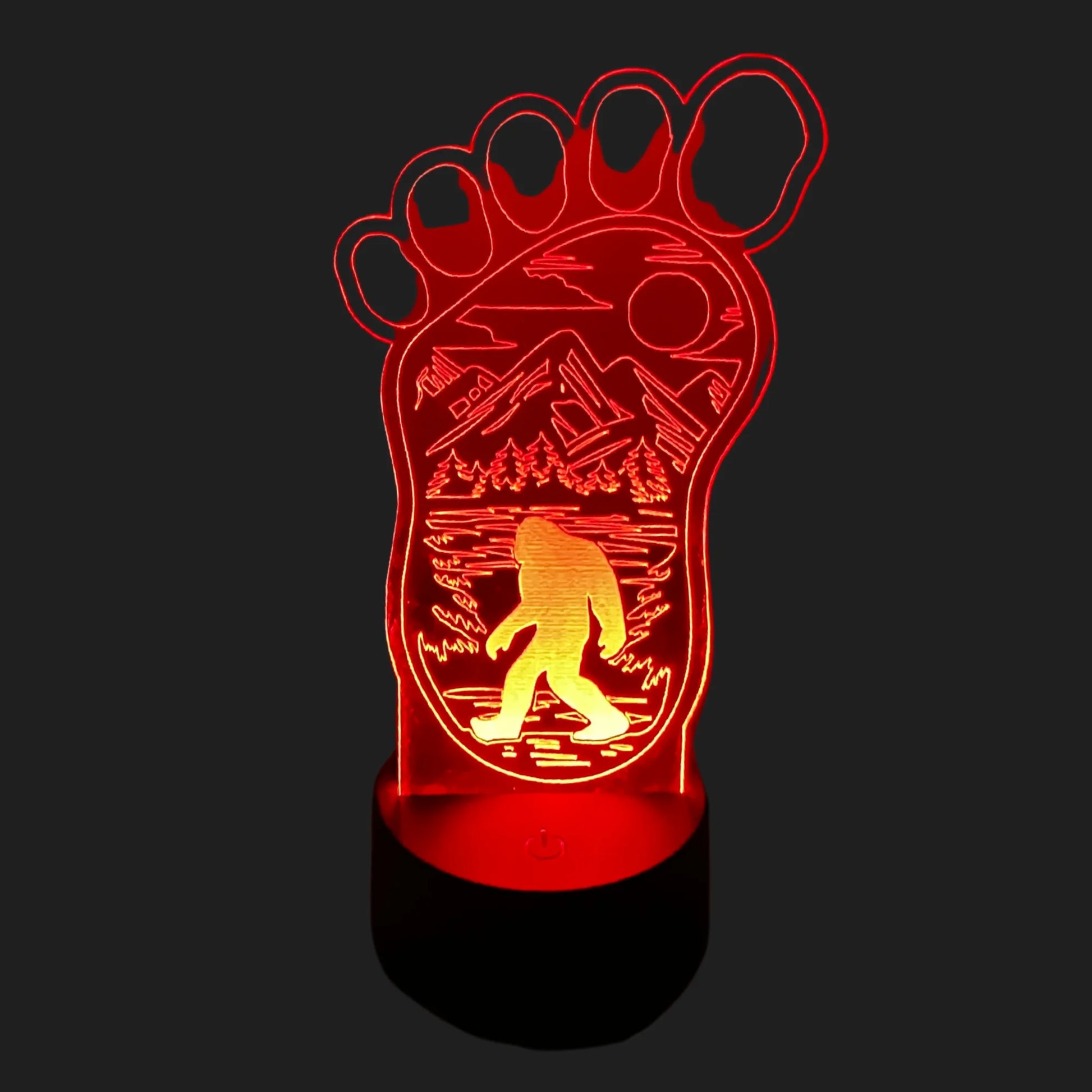 Bigfoot footprint LED lamp glowing red with mountain forest and Sasquatch silhouette.