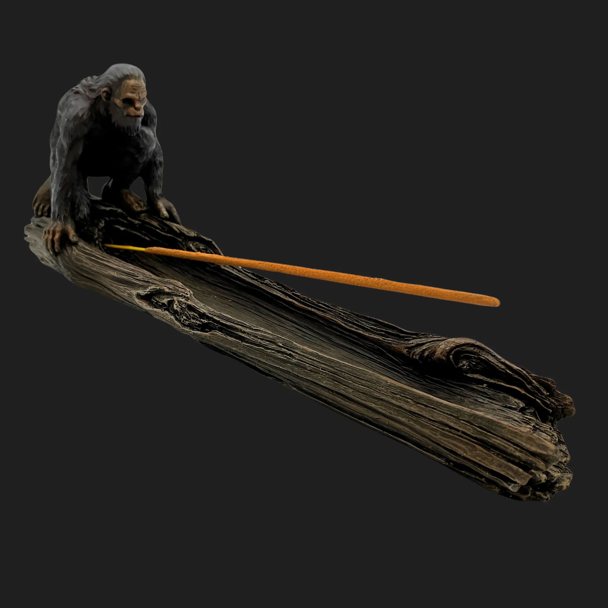 Bigfoot incense burner crouched on log with incense stick