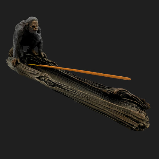 Bigfoot incense burner crouched on log with incense stick