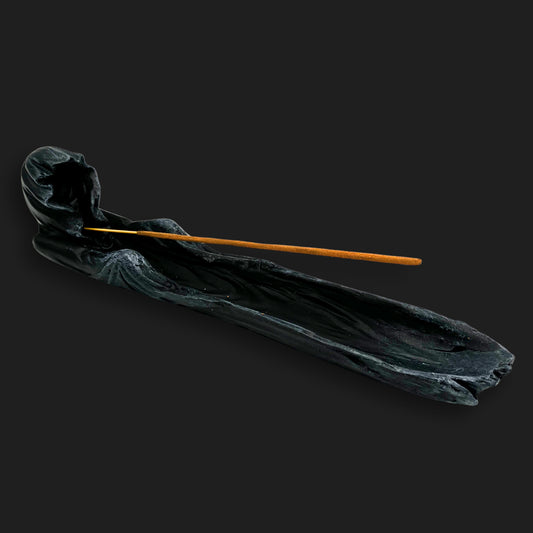 Angled photo of a gothic Grim Reaper incense burner showing the flowing cloak design