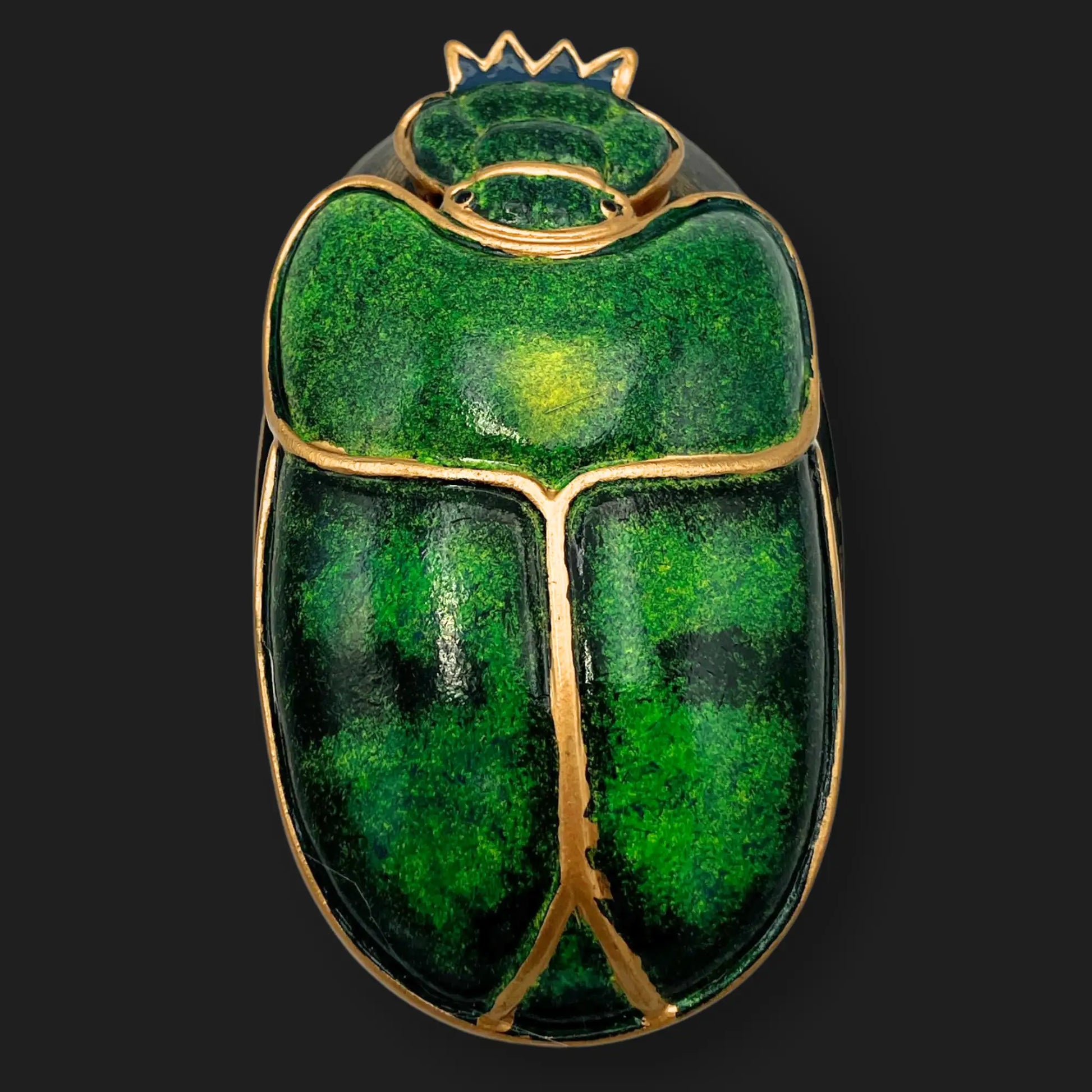 Top view of 4” x 2.5” emerald green and gold scarab beetle relic with Egyptian design.