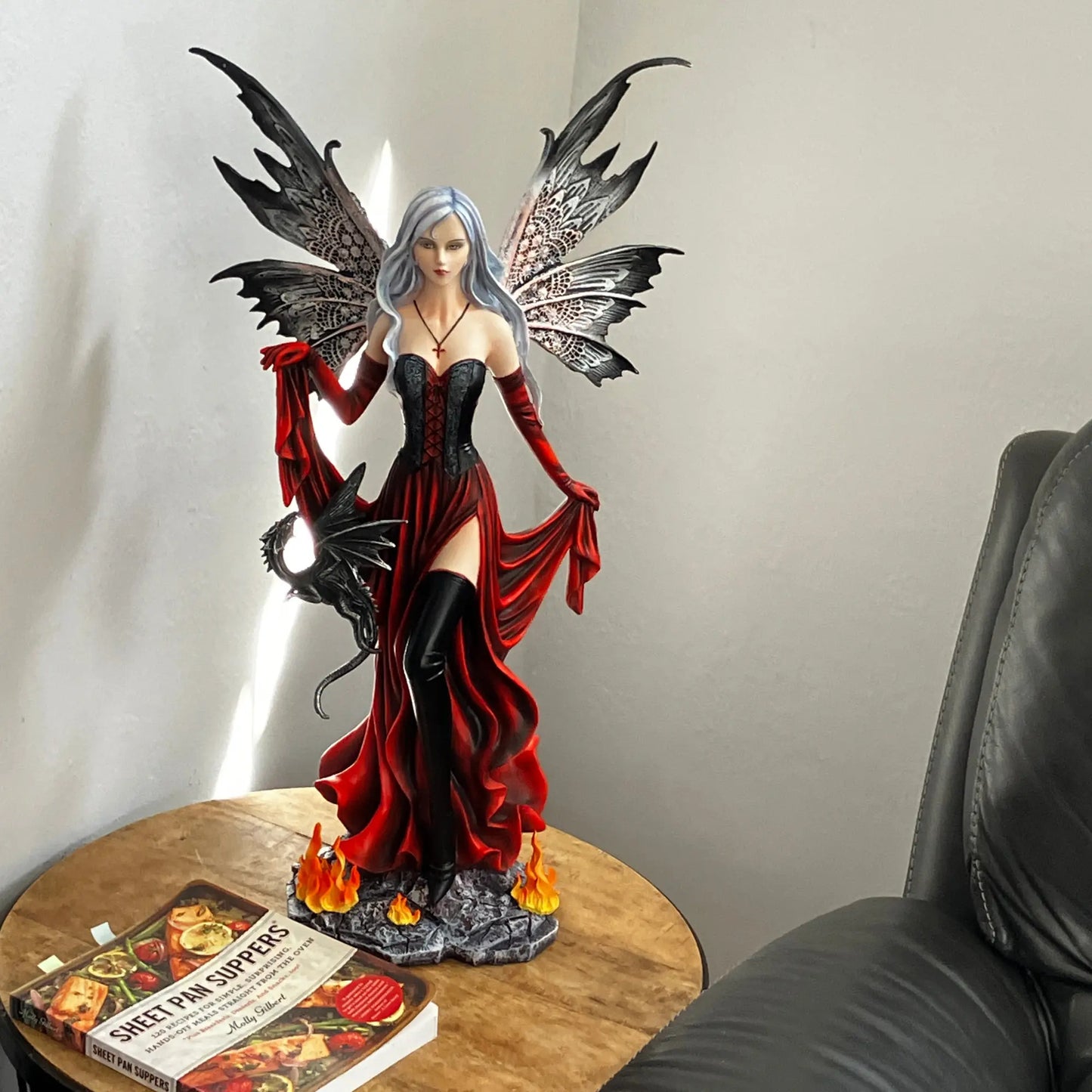 Enchantress fairy gothic décor statue featuring red gown, thigh-high boots, and dragon companion