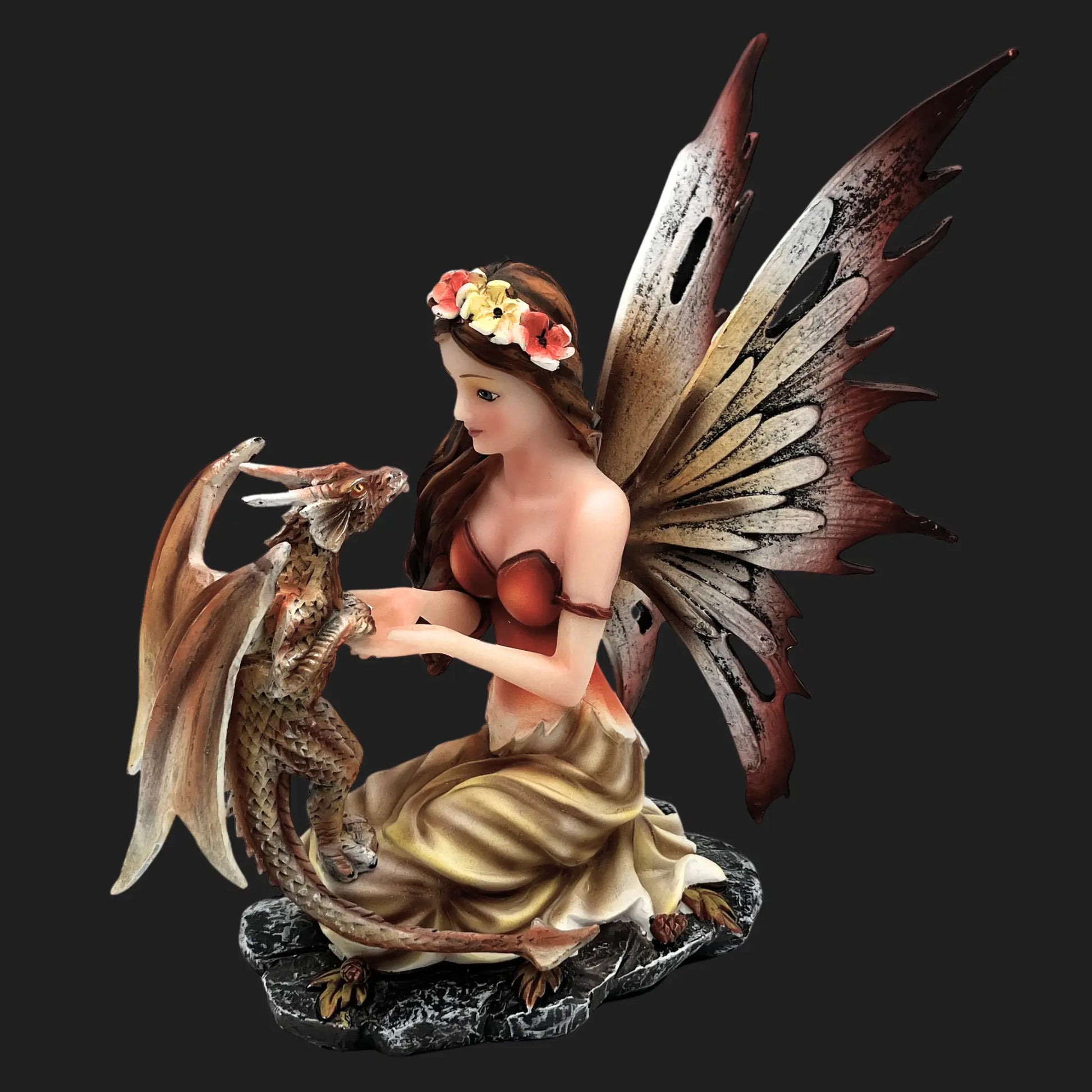 Front view of fairy kneeling with dragon statue, enchanted fantasy collectible.
