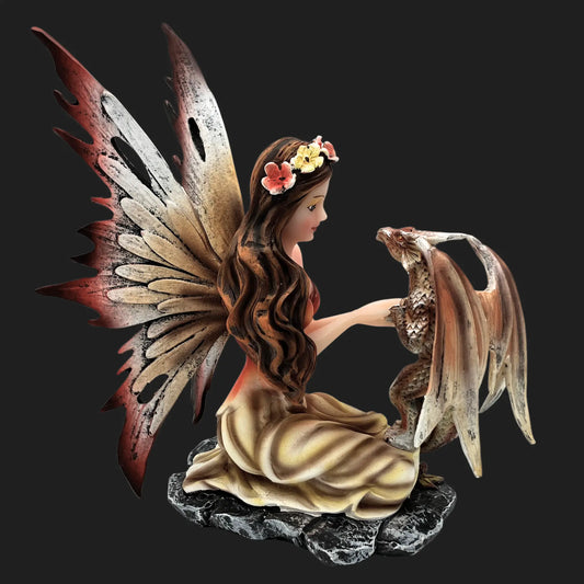 Side view of fairy and dragon figurine showing enchanted bond, fantasy décor.