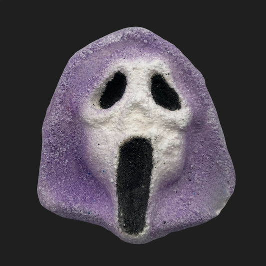 Purple and white bath bomb shaped like Ghostface mask from Scream
