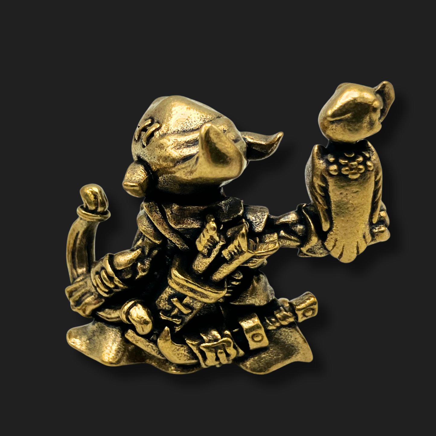 Rear view of bronze goblin falconer figurine holding a vulture companion, detailed resin miniature from Lair of Mythics.