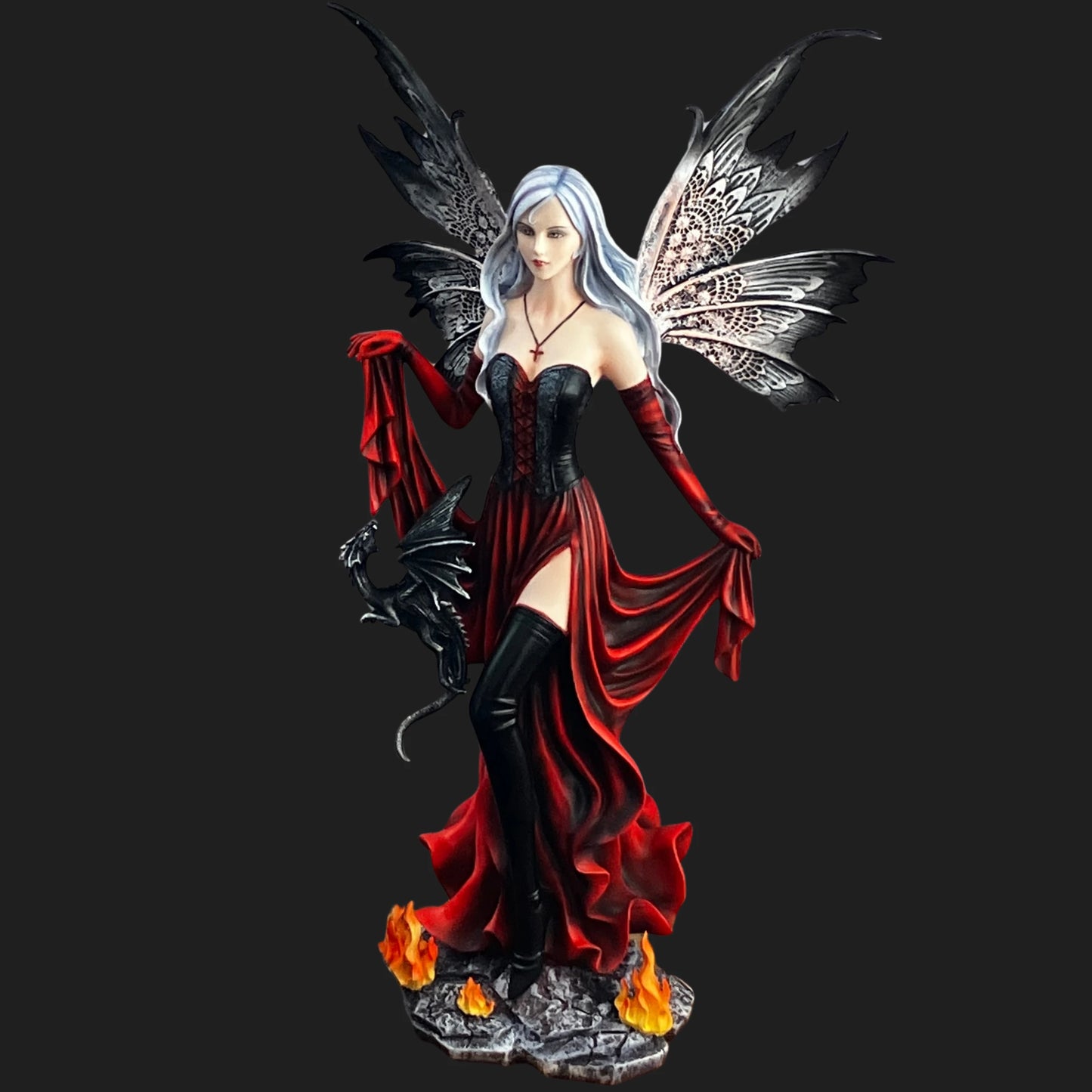 Gothic fantasy fairy figurine holding a black dragon, standing on a fiery stone base