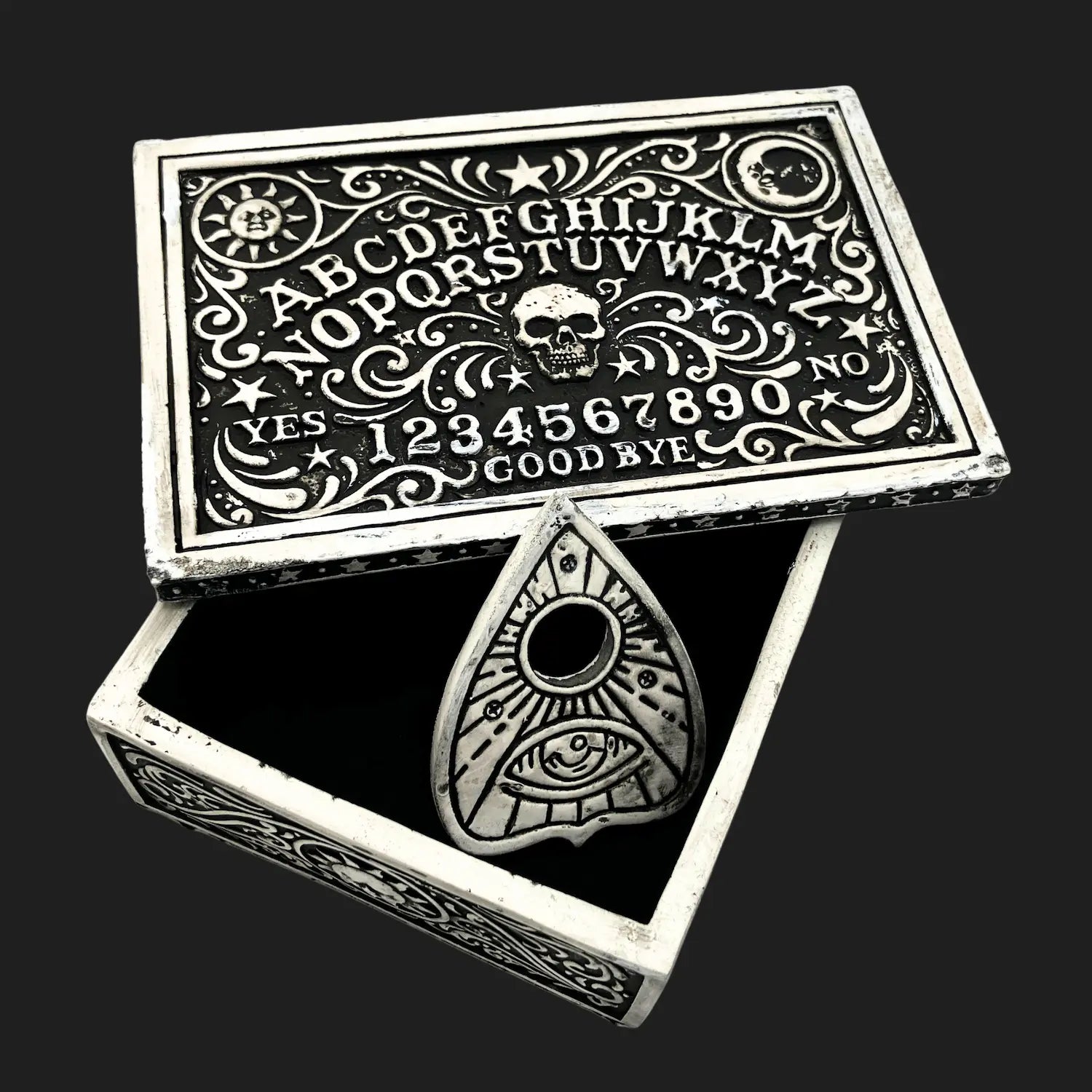 Open Ouija board storage box with planchette inside, occult décor piece