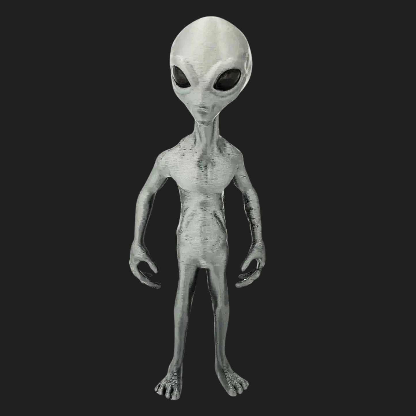 Front view of a 7-inch Grey Visitor alien figurine with large black eyes.