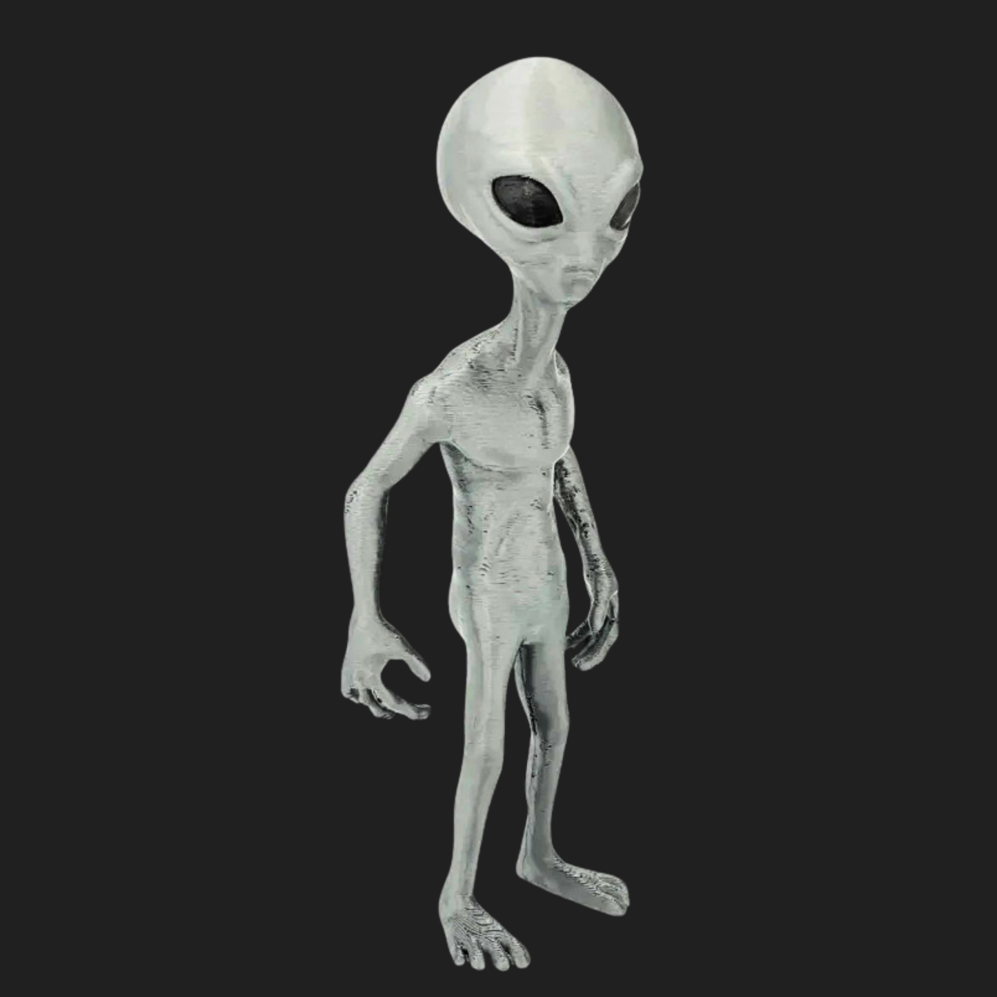 Angled side view of the 7-inch Grey Visitor alien model with elongated limbs.