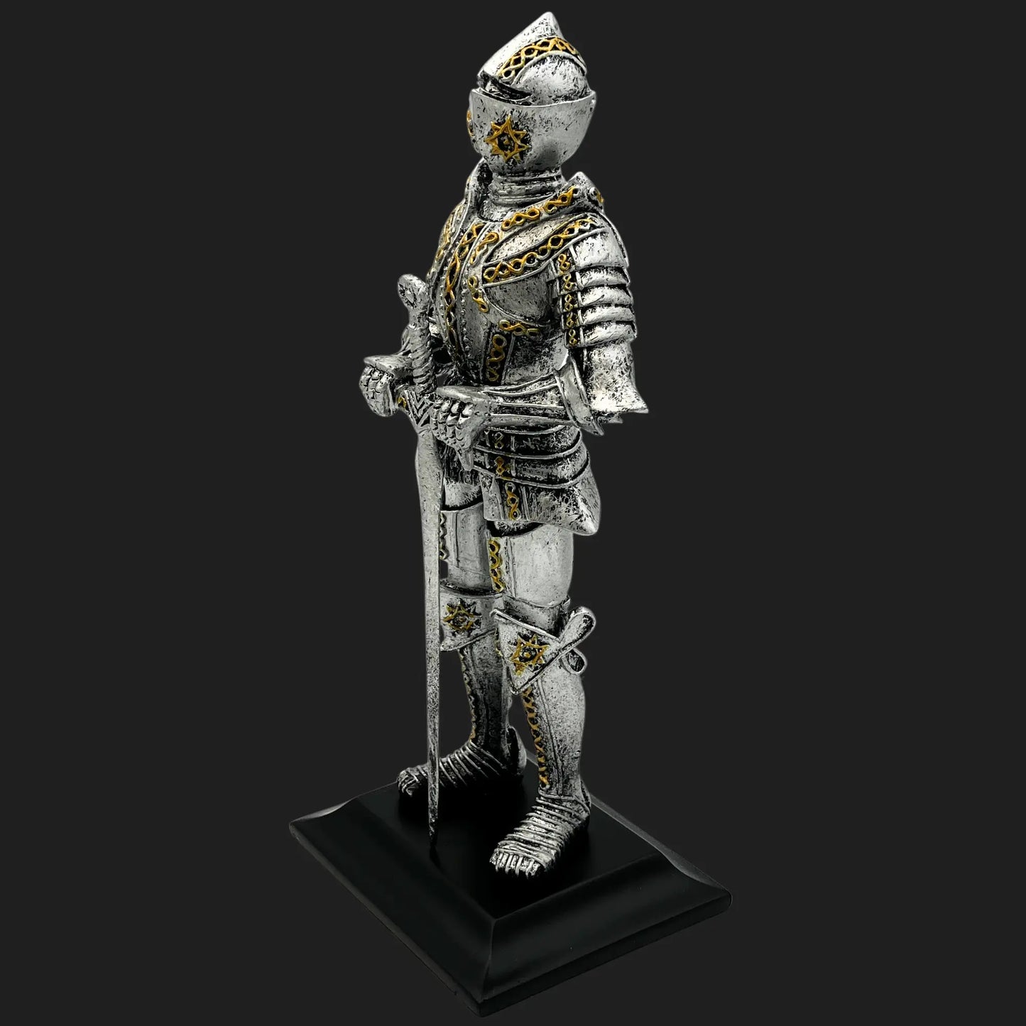 Side view of silver and gold Knight of the Northern Star medieval statue