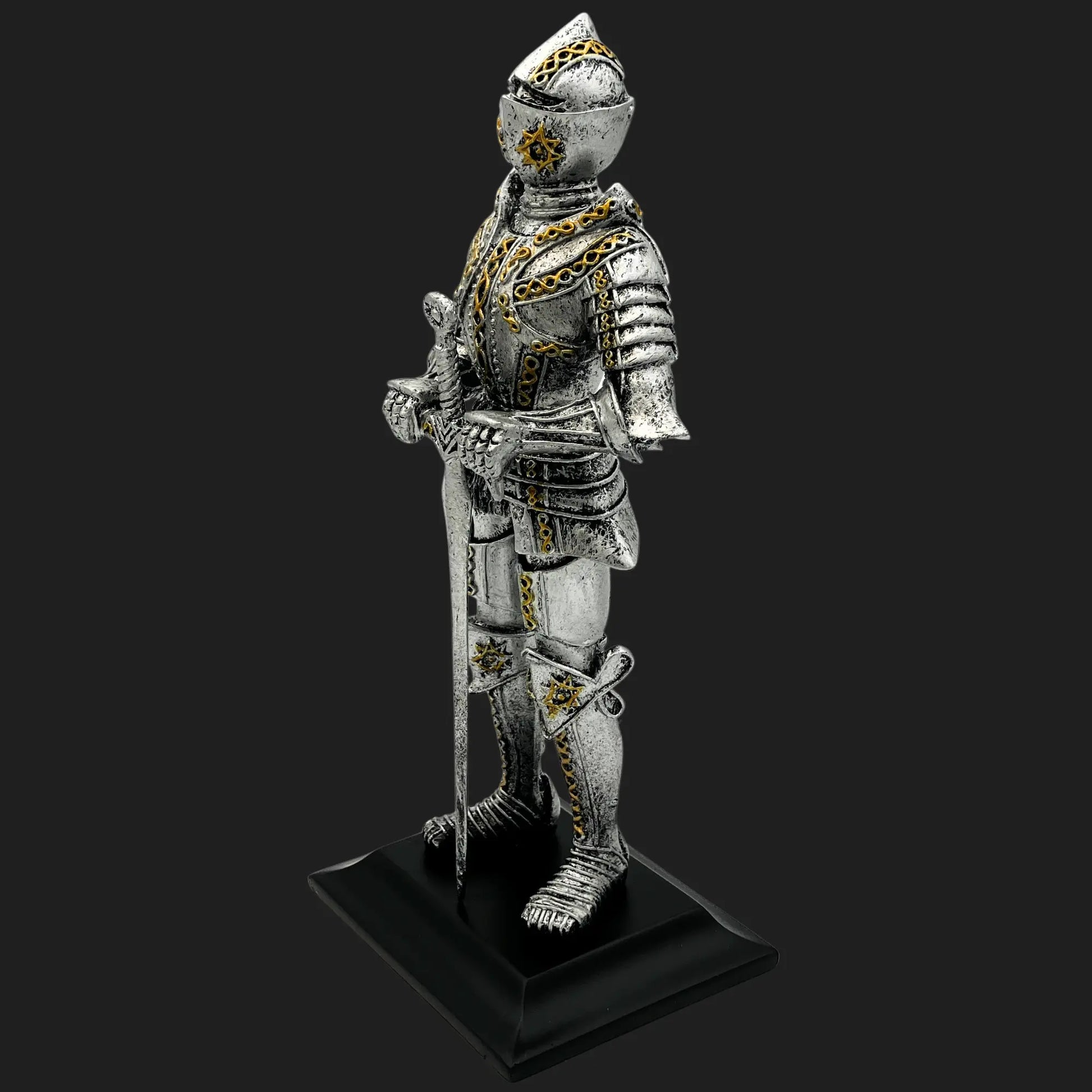 Side view of silver and gold Knight of the Northern Star medieval statue