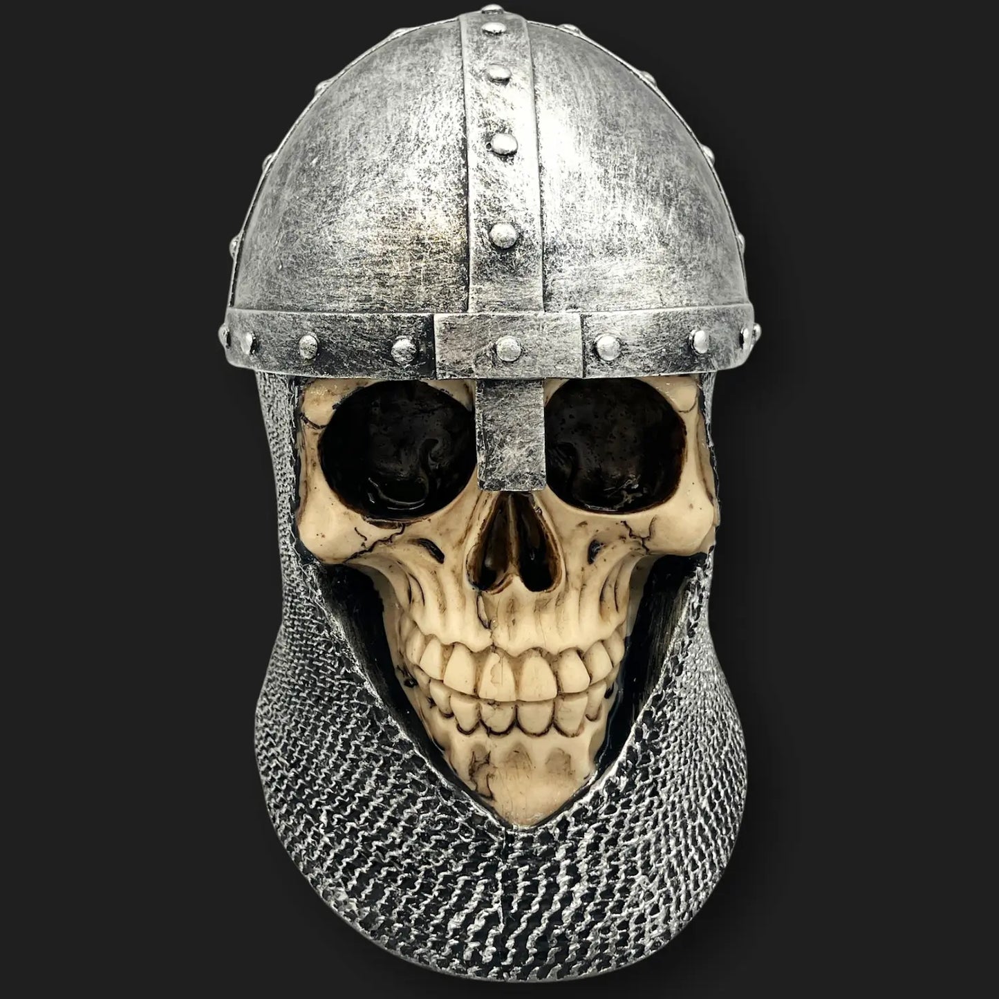 Front view of medieval knight skull with silver helmet and chainmail gothic décor.