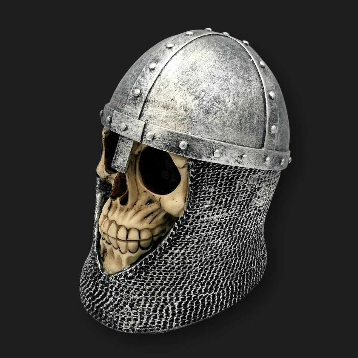 Side angle of knight skull with riveted helmet and chainmail gothic relic.