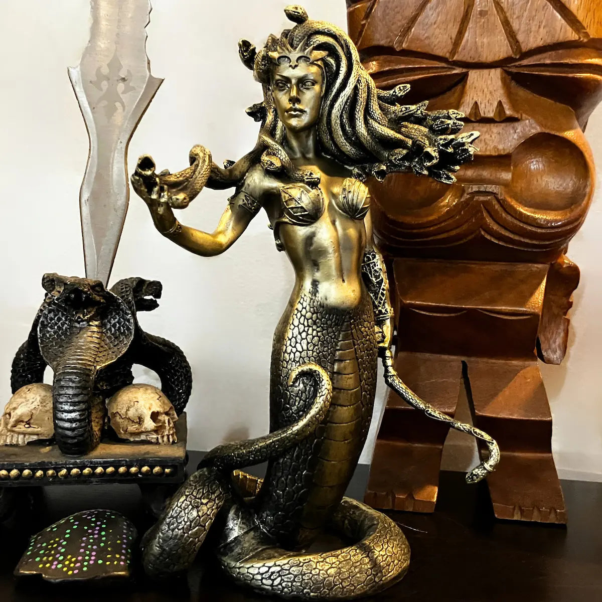 Front view of Medusa serpent goddess statue used as mythical home décor, featuring snake hair and bronze serpent tail