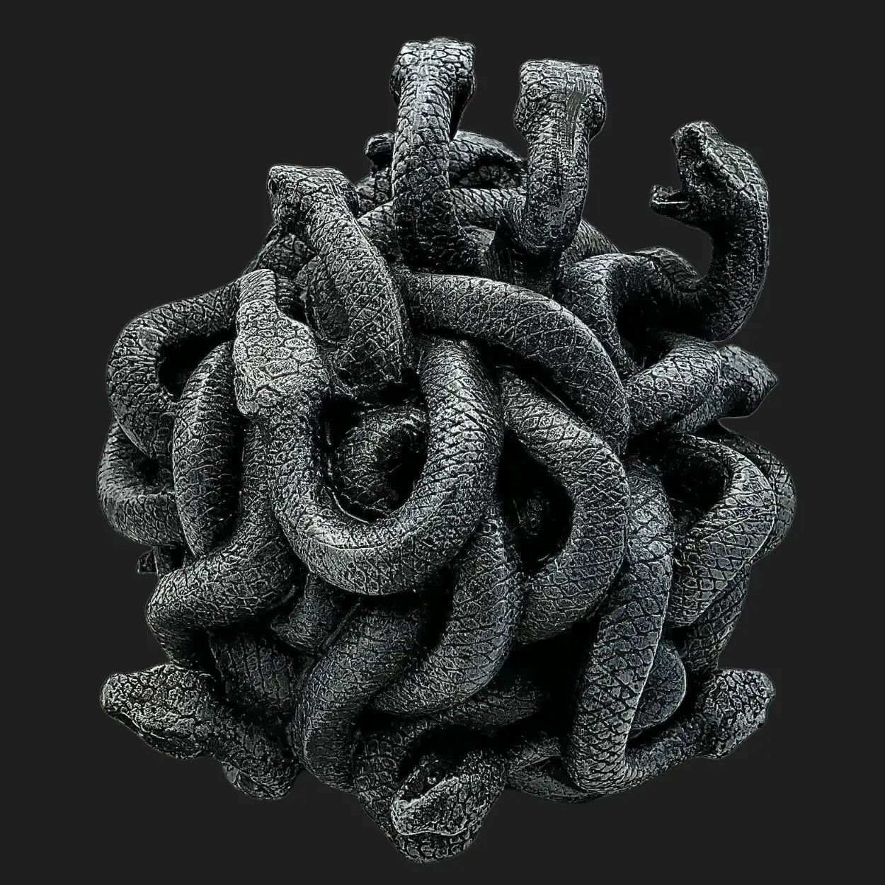 Close-up of black serpents forming Medusa’s legendary hair in a textured sculpture design.