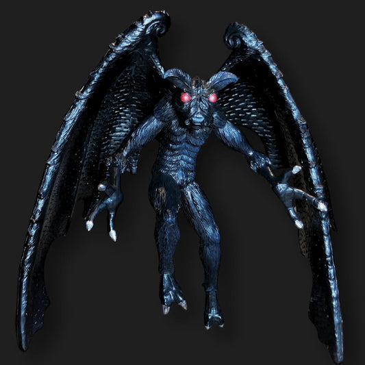 Dark Mothman figurine with glowing red eyes, textured black wings, and clawed feet.