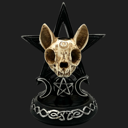 Occult cat skull statue with engraved runes, black pentagram backdrop, and crescent moon symbols