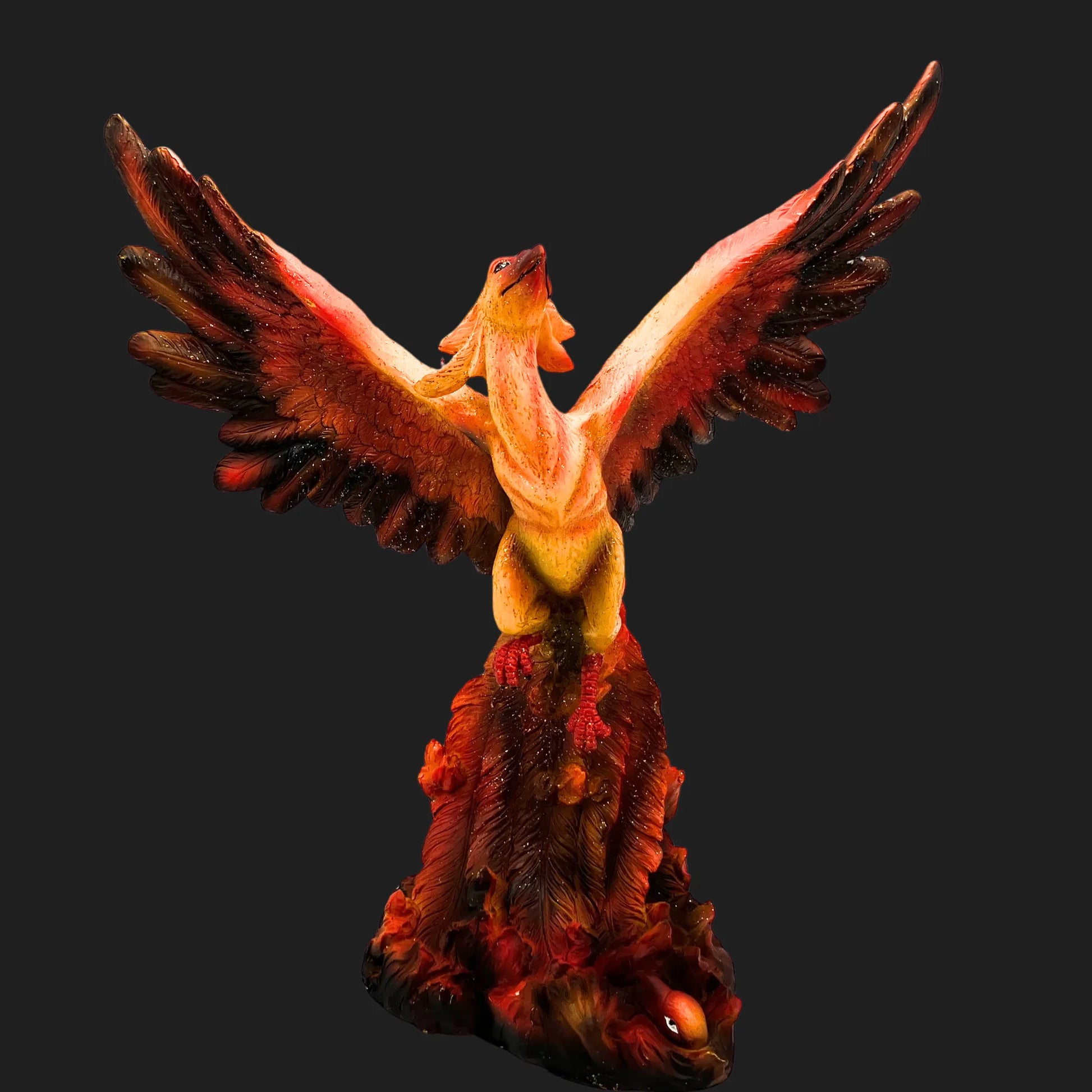 Front view of 10.5-inch Phoenix Rising figurine with fiery wings spread wide