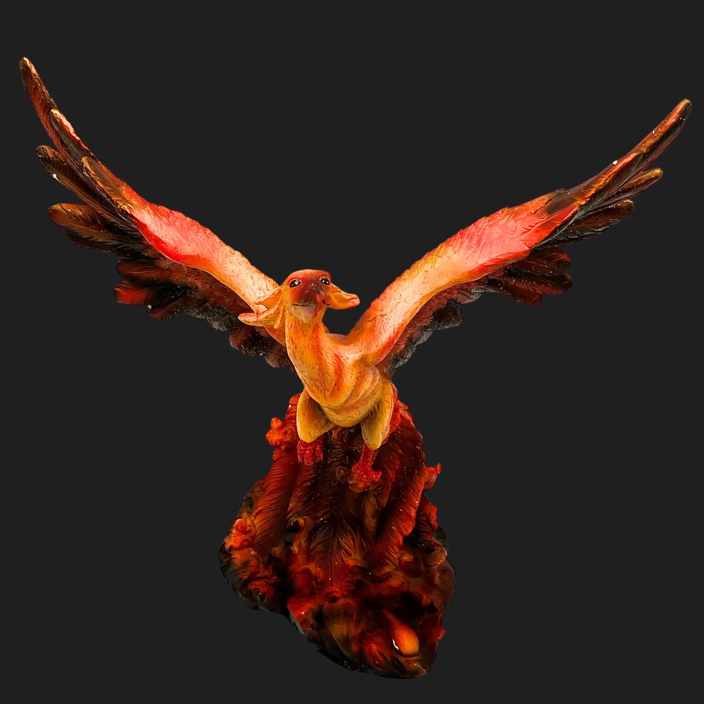 Front view of 10.5-inch Phoenix Rising figurine with fiery red orange wings spread wide