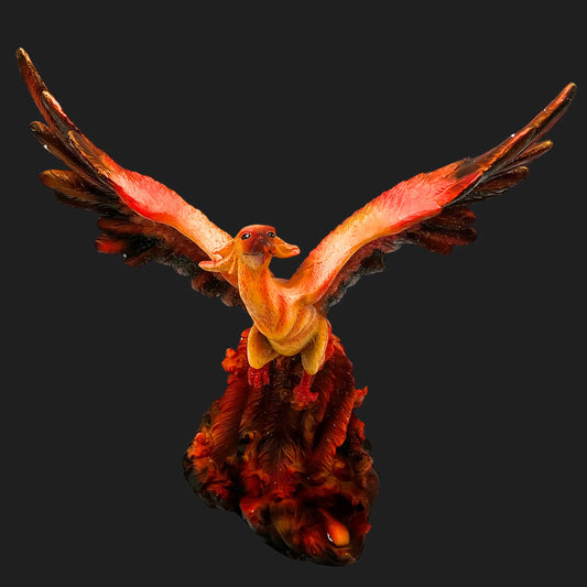 Front view of 10.5-inch Phoenix Rising figurine with fiery red orange wings spread wide