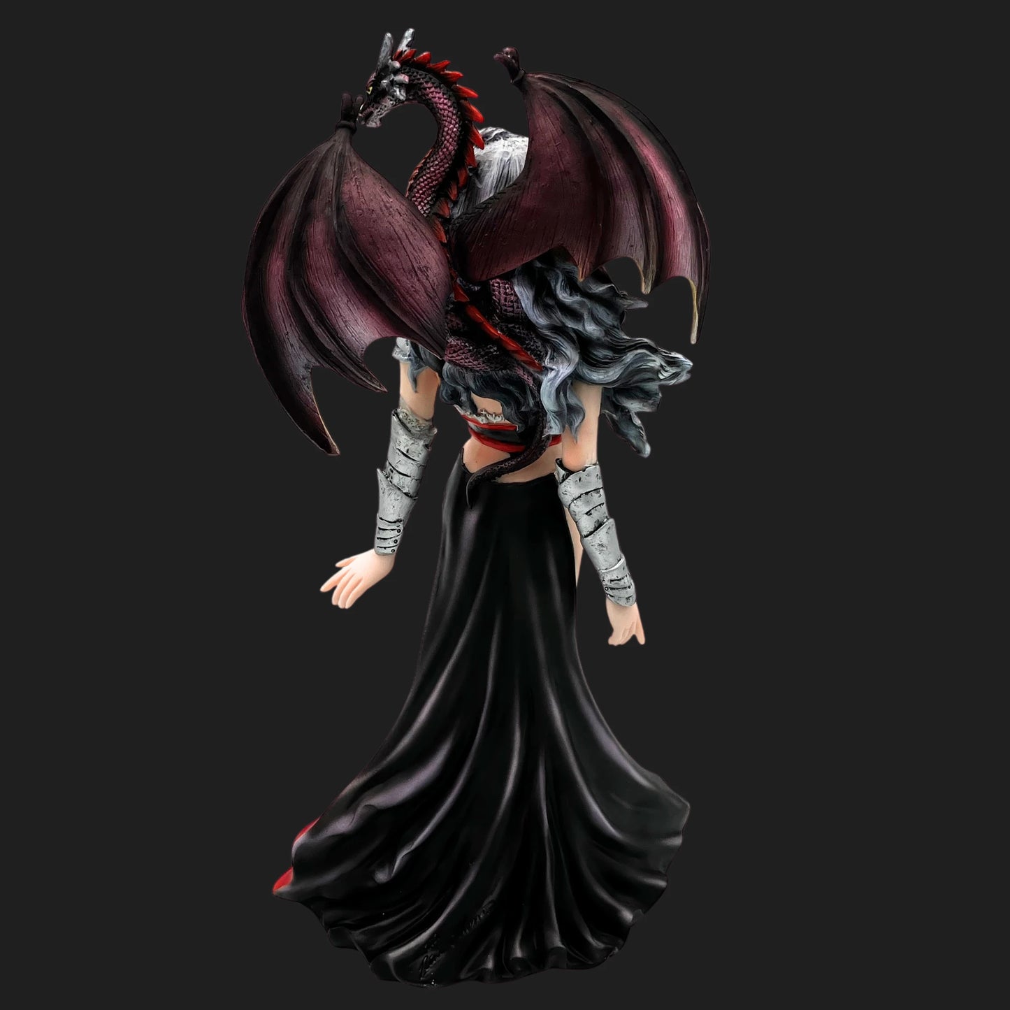 Back angle of Severeille witch figurine showing dragon wings spread wide and detailed gothic gown