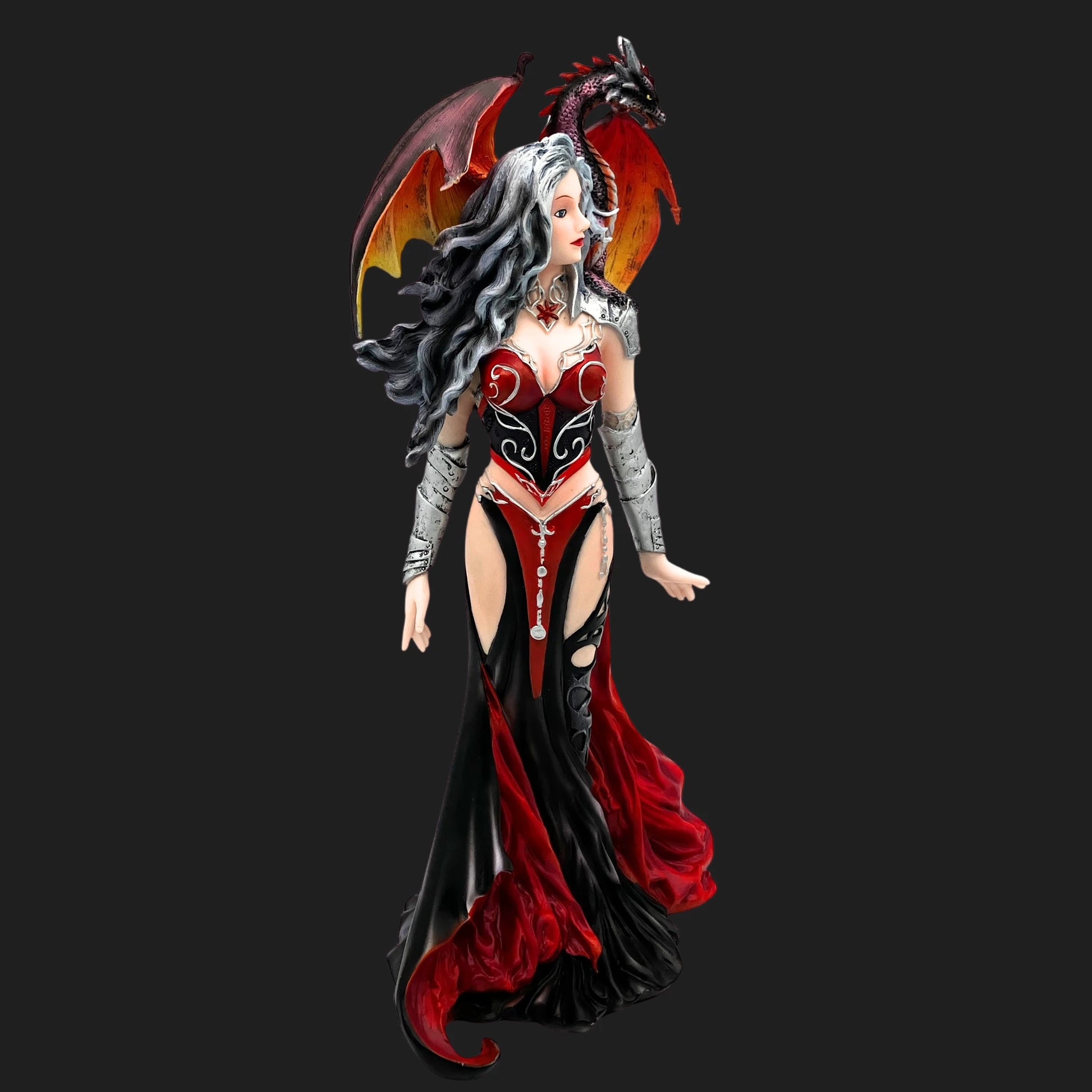 Severeille witch figurine in red and black gown with silver armor, dragon Emberwing perched on her shoulder.