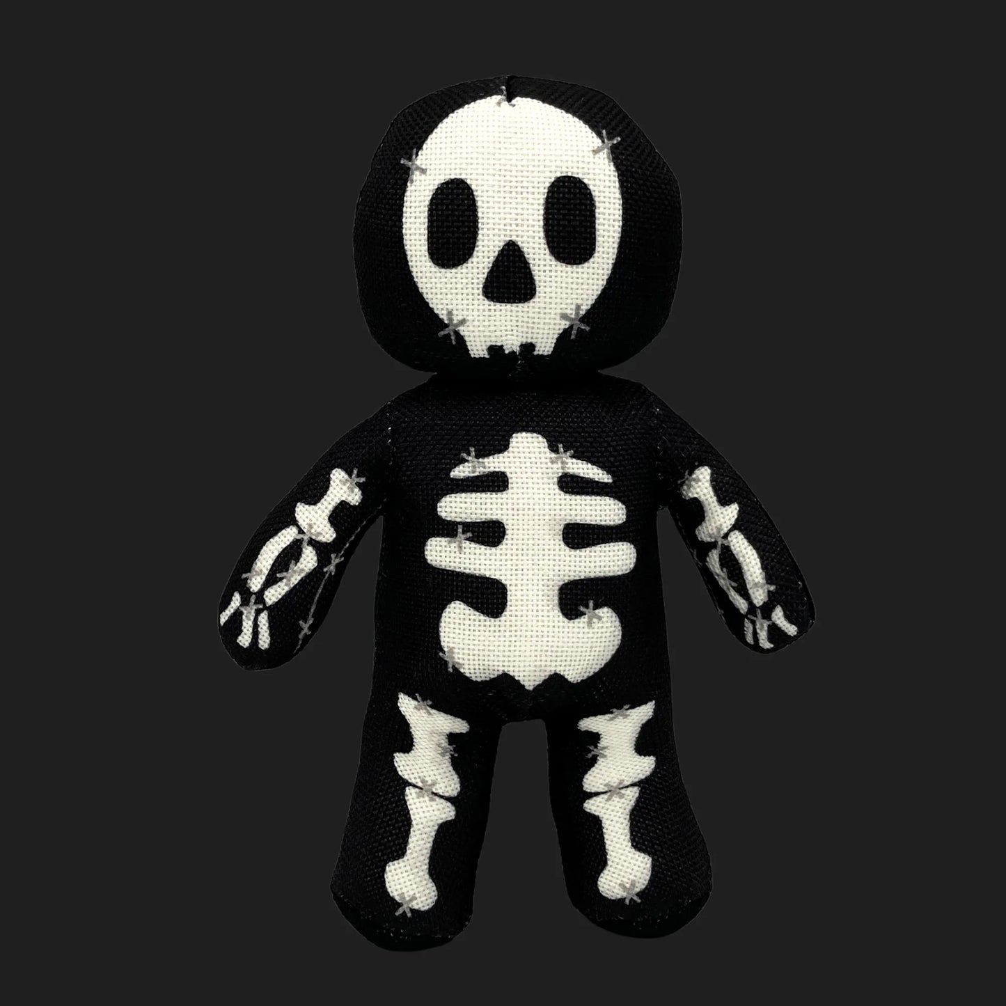 Skeleton voodoo doll plush with stitched skull face and bone patterns — gothic skeleton stuffed figure.
