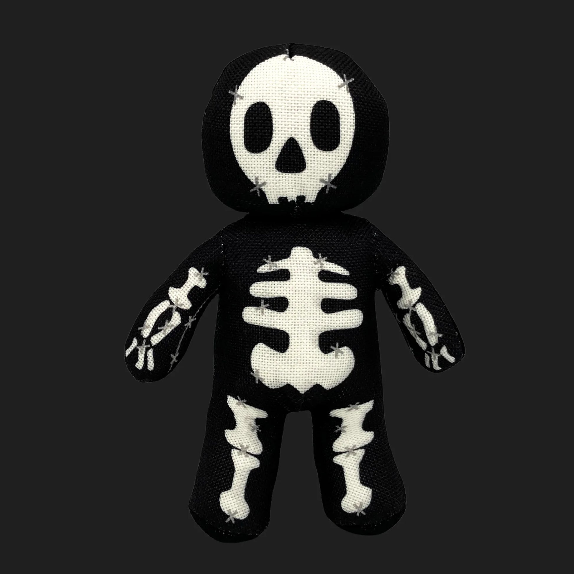 Skeleton voodoo doll plush with stitched skull face and bone patterns — gothic skeleton stuffed figure.