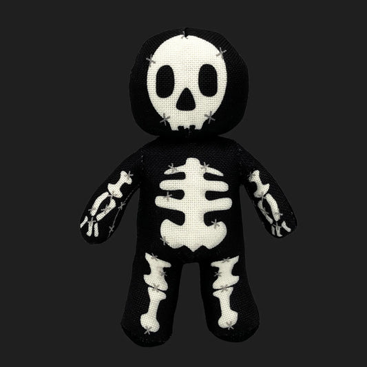 Skeleton voodoo doll plush with stitched skull face and bone patterns — gothic skeleton stuffed figure.
