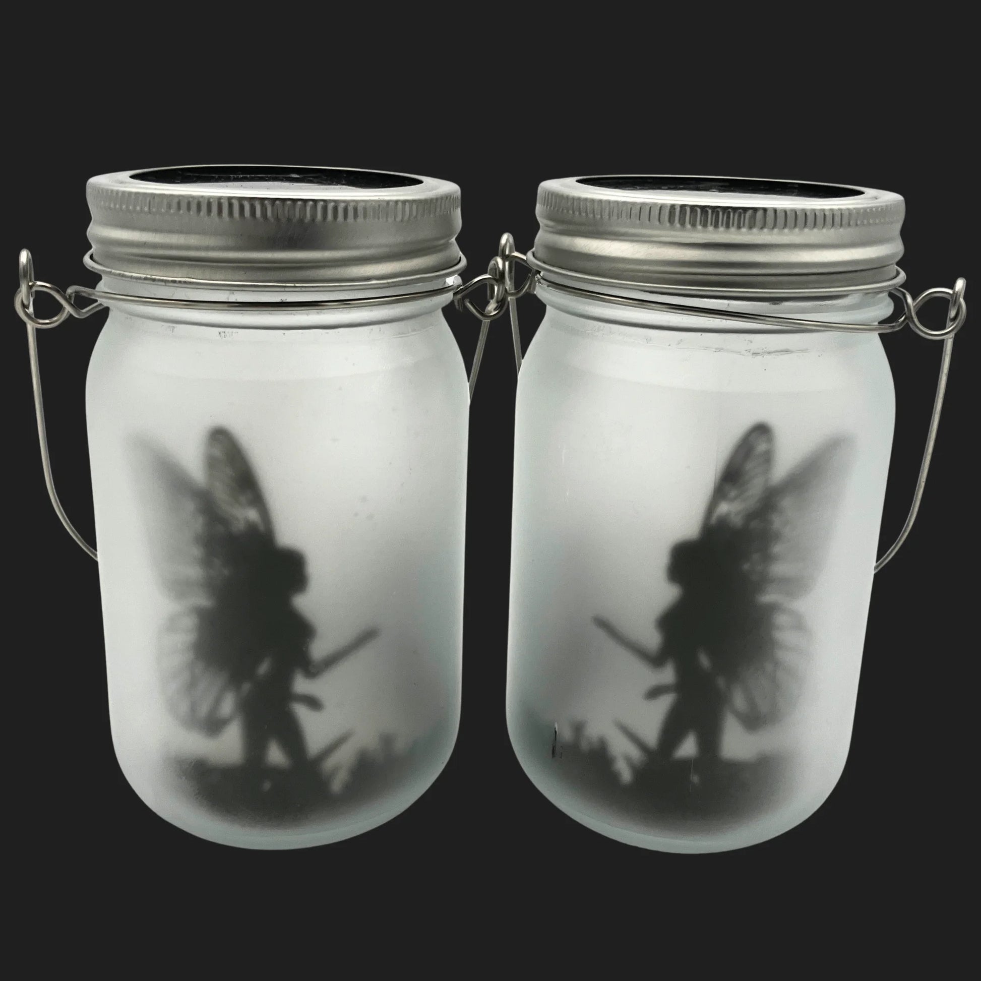 Solar powered fairy jar with glowing warrior fairy silhouette in frosted glass lantern