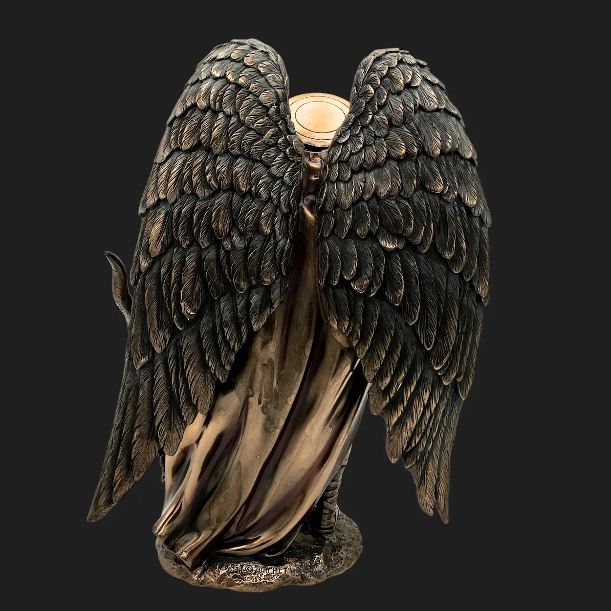 Back view of St. Michael statue showing sculpted angel wings in bronze finish