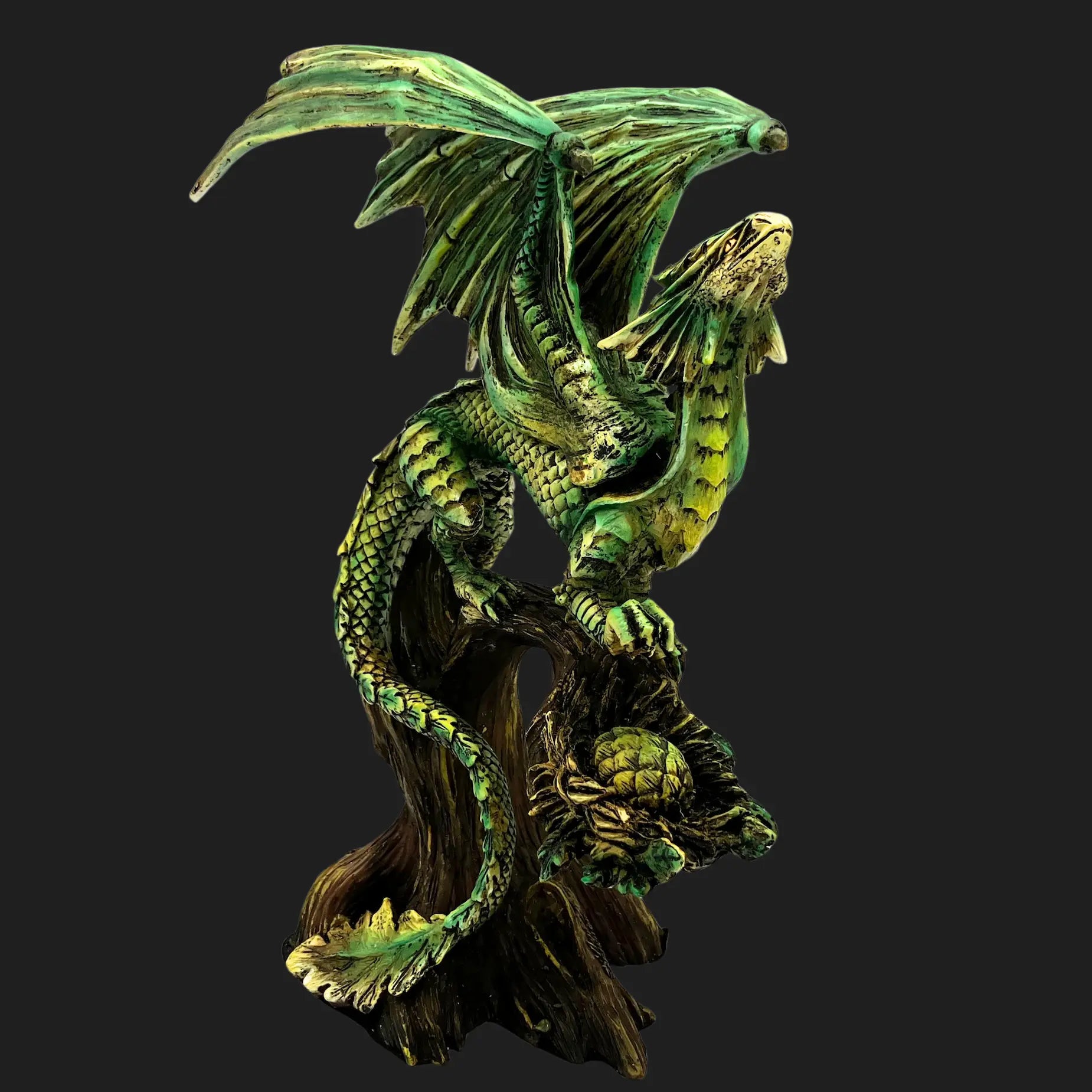 Front view of 10.5” Tree Dragon Figurine coiled around tree trunk with emerald green wings