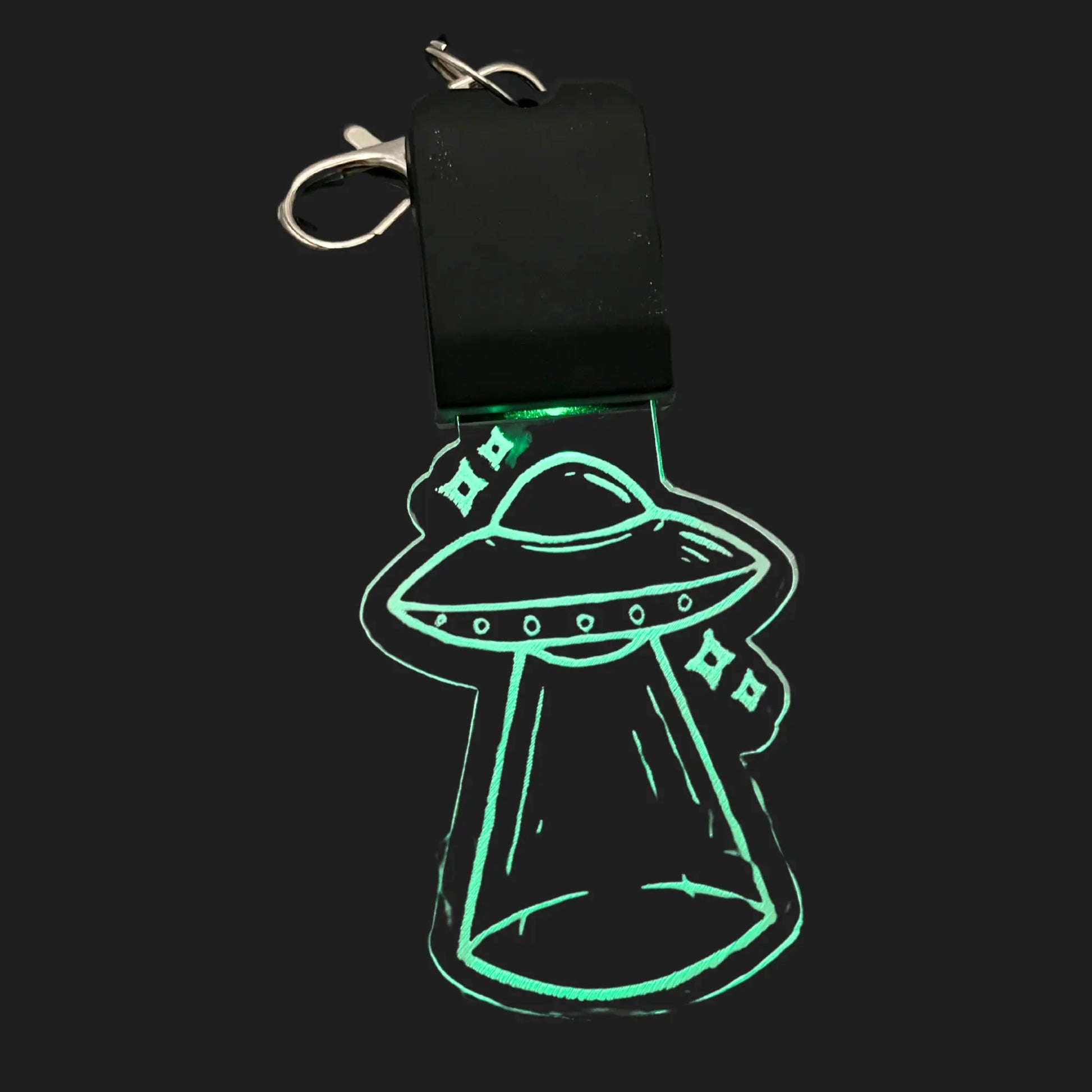 UFO LED charm glowing green with abduction beam design
