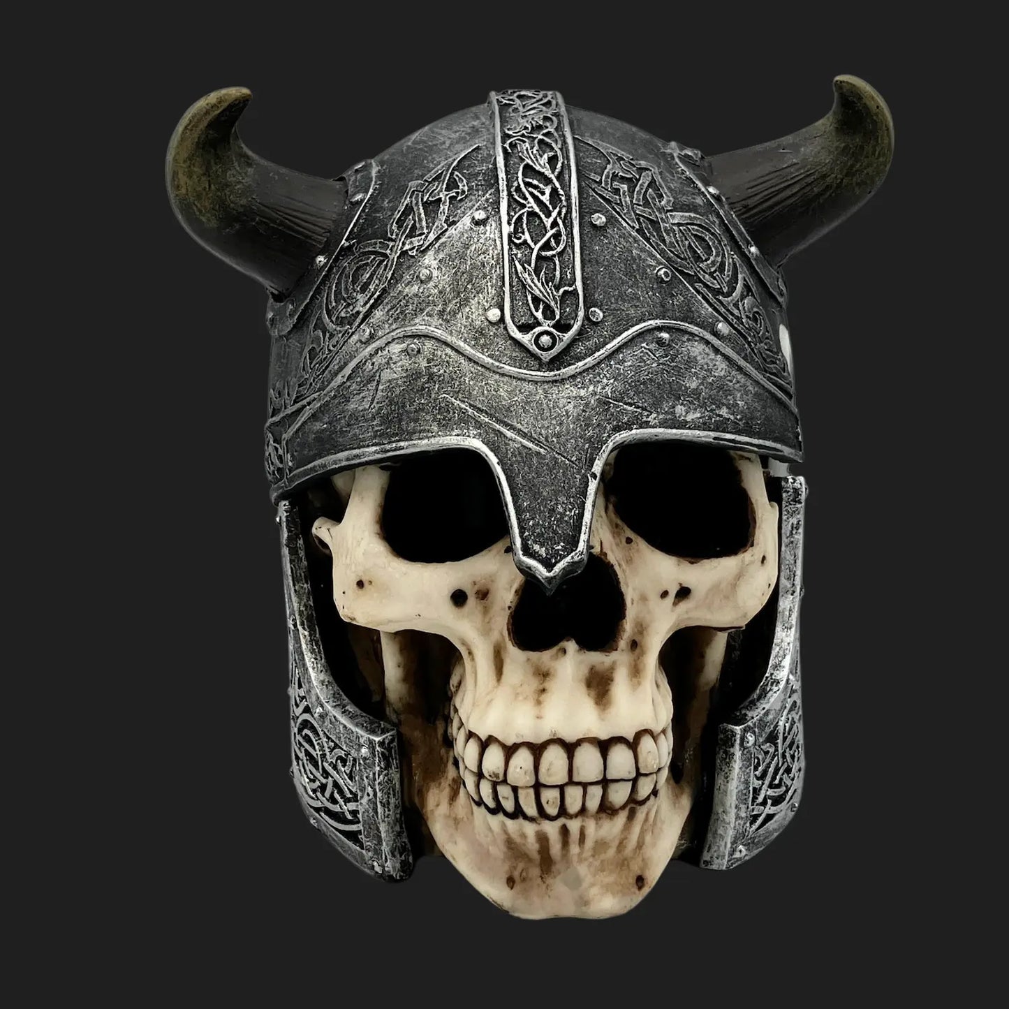 Front view Viking skull with horned helmet and detailed Norse engravings