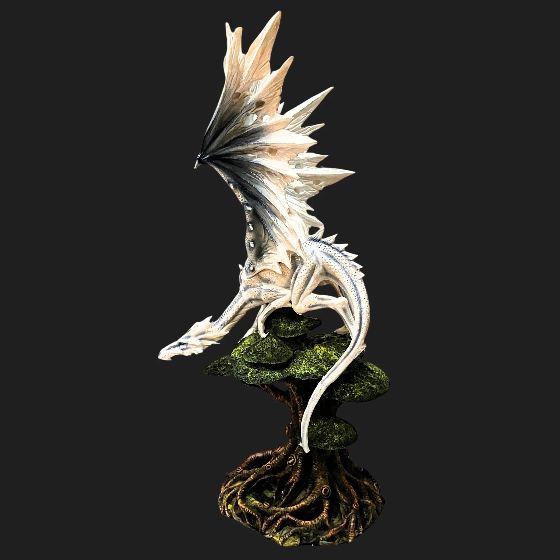Front view of the 21.5" White Dragon statue, wings spread wide atop a twisted tree base