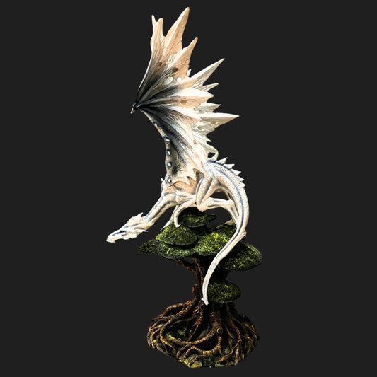 Front view of the 21.5" White Dragon statue, wings spread wide atop a twisted tree base